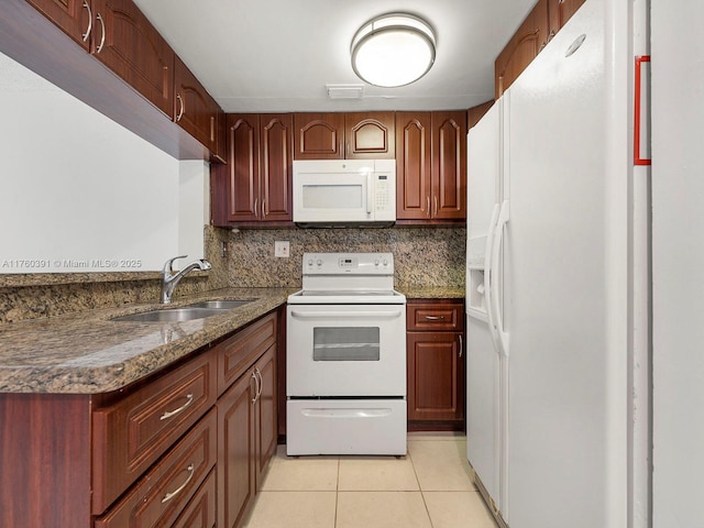 8585 NW 6th Ln Unit 9-208, Miami, FL 33126 - kitchen featuring white appliances, light tile patterned flooring, dark stone countertops, and tasteful backsplash