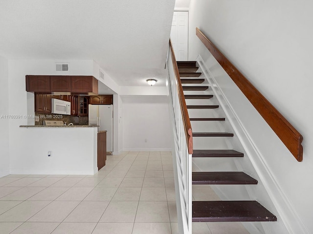 8585 NW 6th Ln Unit 9-208, Miami, FL 33126 - stairs with tile patterned floors and baseboards