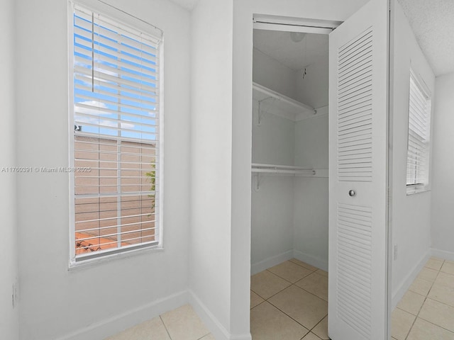 8585 NW 6th Ln Unit 9-208, Miami, FL 33126 - spacious closet with tile patterned floors