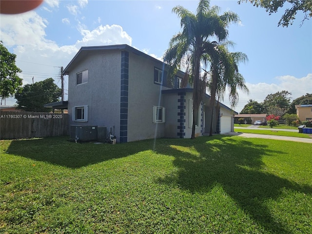 view of property exterior with cooling unit, a lawn, an attached garage, and fence