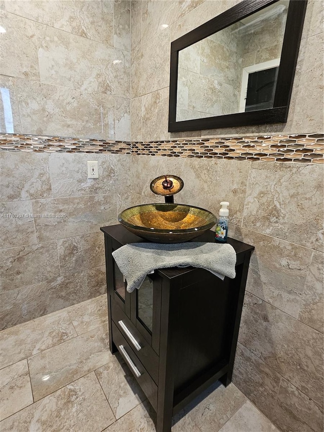 bathroom featuring tile walls and vanity