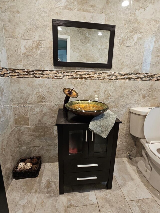 bathroom featuring toilet and vanity