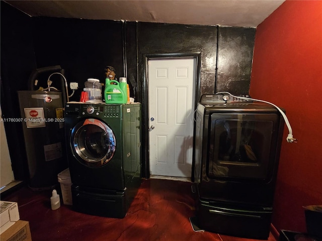 laundry room featuring electric water heater, wood finished floors, laundry area, and washer and clothes dryer