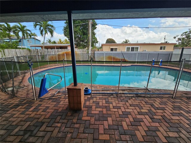 view of pool with a fenced in pool, a patio, and a fenced backyard