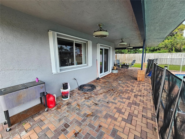 view of patio / terrace featuring fence