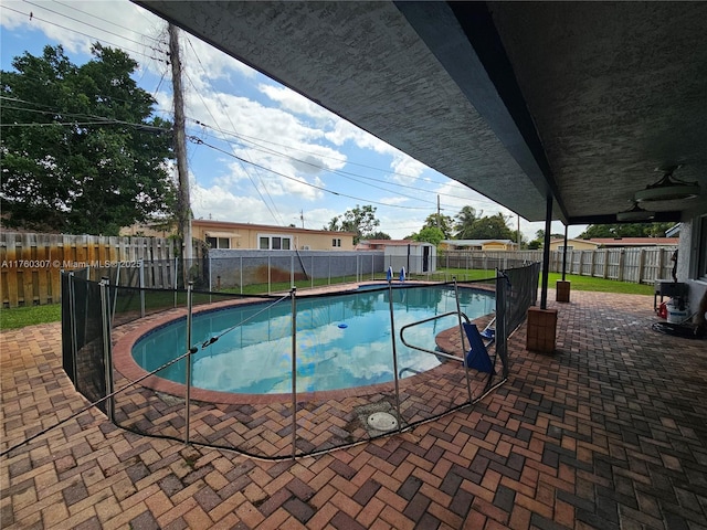 view of swimming pool featuring a patio area, a fenced backyard, and a fenced in pool