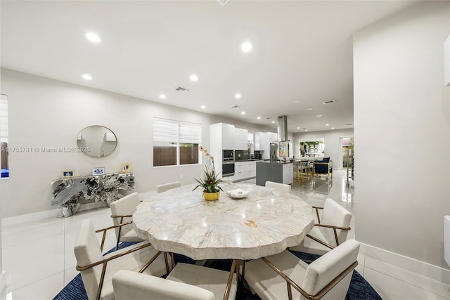 dining room featuring recessed lighting, visible vents, a wealth of natural light, and light tile patterned flooring