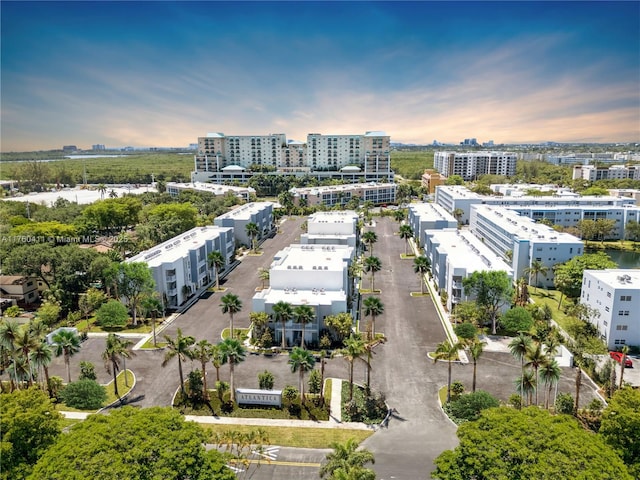 birds eye view of property featuring a view of city