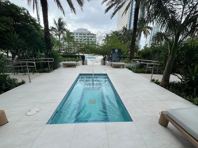 pool with a patio area