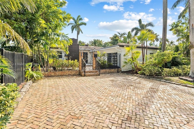 view of front of home featuring a fenced front yard and a gate