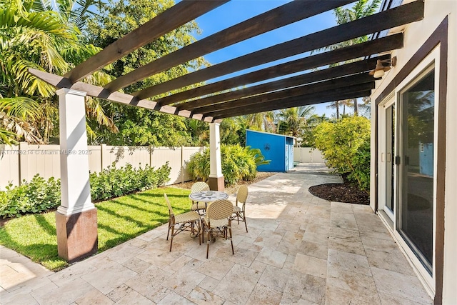 1134 Van Buren St, Hollywood, FL 33019 - view of patio / terrace featuring outdoor dining area, a fenced backyard, and a pergola