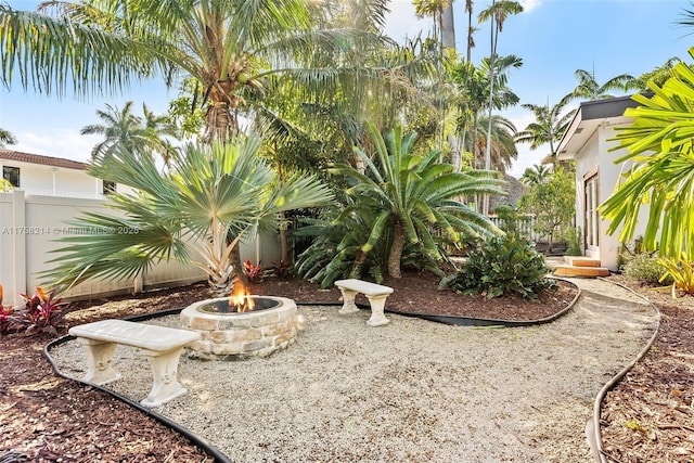 1134 Van Buren St, Hollywood, FL 33019 - view of yard featuring fence and an outdoor fire pit