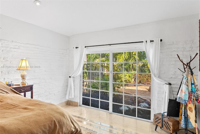 1134 Van Buren St, Hollywood, FL 33019 - tiled bedroom featuring brick wall