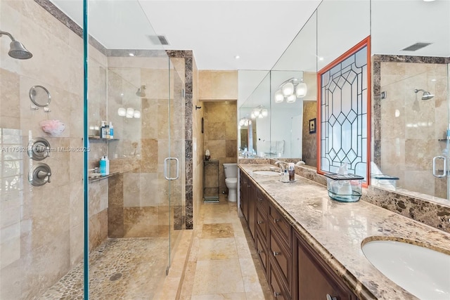 1134 Van Buren St, Hollywood, FL 33019 - full bathroom featuring a sink, visible vents, a stall shower, and double vanity