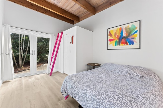 1134 Van Buren St, Hollywood, FL 33019 - bedroom featuring wood finished floors, beam ceiling, french doors, access to outside, and multiple windows