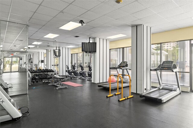 gym featuring a drop ceiling