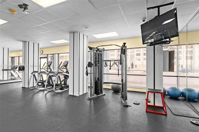 exercise room featuring a drop ceiling