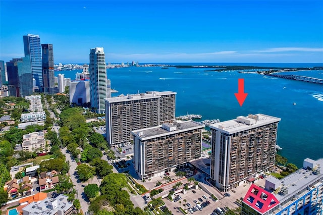 aerial view featuring a view of city and a water view