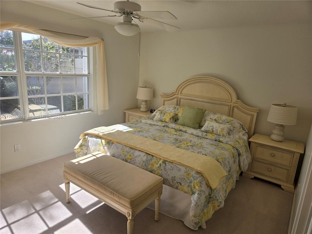 bedroom featuring carpet, baseboards, and ceiling fan