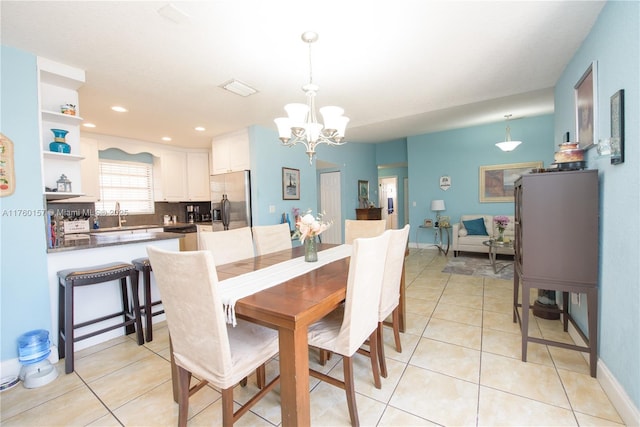 dining area featuring light tile patterned floors, baseboards, visible vents, an inviting chandelier, and recessed lighting