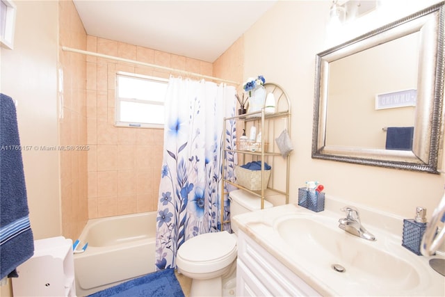 bathroom featuring vanity, toilet, and shower / bath combo with shower curtain