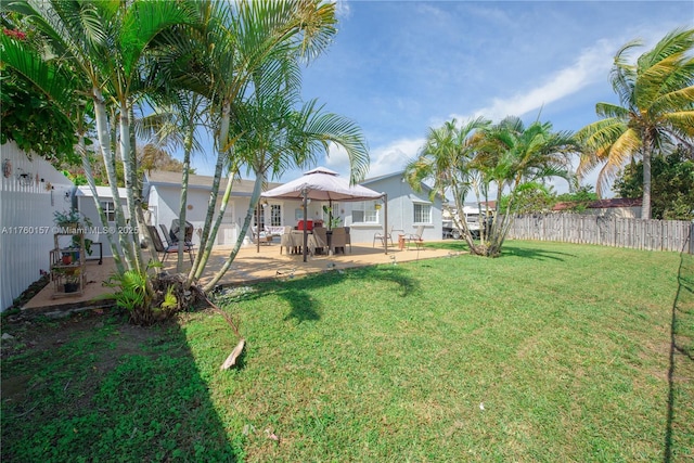 view of yard with a patio and fence