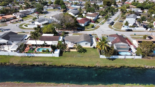 bird's eye view with a residential view and a water view