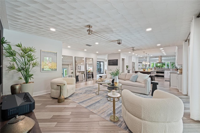 8234 SW 60th Ct, South Miami, FL 33143 - living room with beverage cooler, light wood-style flooring, and recessed lighting