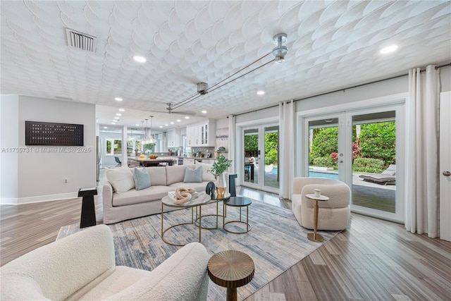 8234 SW 60th Ct, South Miami, FL 33143 - living area featuring light wood finished floors and recessed lighting