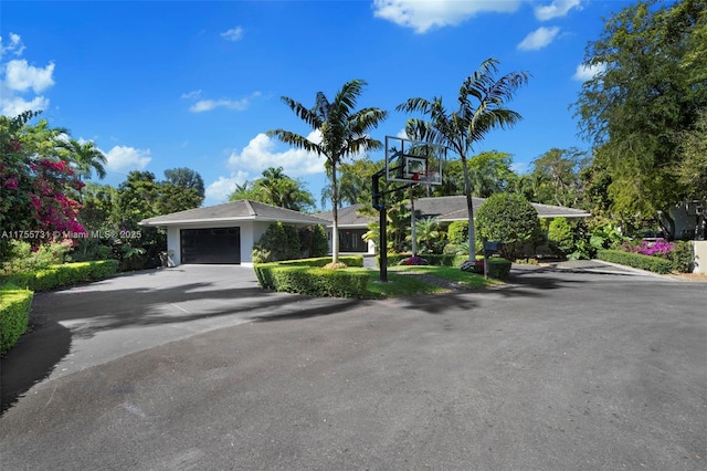 8234 SW 60th Ct, South Miami, FL 33143 - view of front of house with an attached garage and driveway