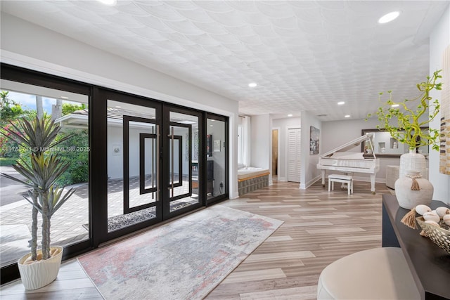 8234 SW 60th Ct, South Miami, FL 33143 - foyer featuring recessed lighting, light wood-type flooring, and french doors