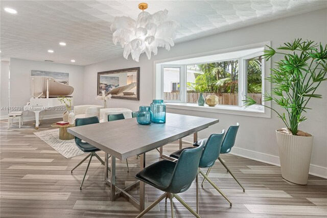 8234 SW 60th Ct, South Miami, FL 33143 - dining space with recessed lighting, a chandelier, and wood finished floors