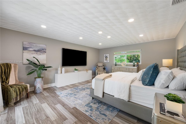 8234 SW 60th Ct, South Miami, FL 33143 - bedroom with wood finished floors and recessed lighting