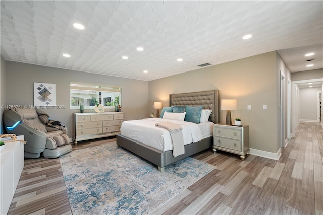 8234 SW 60th Ct, South Miami, FL 33143 - bedroom with light wood-style flooring and recessed lighting