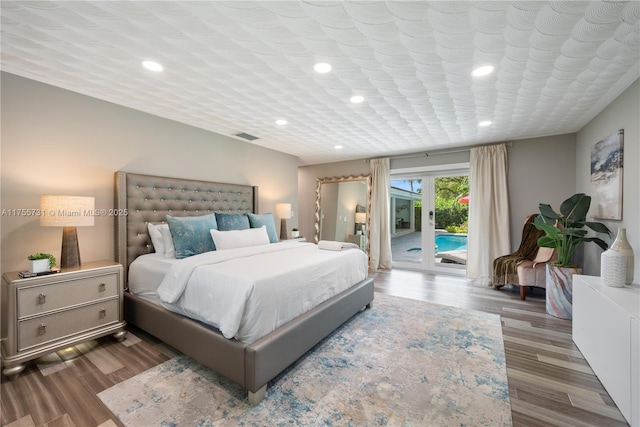 8234 SW 60th Ct, South Miami, FL 33143 - bedroom with access to exterior, recessed lighting, wood finished floors, and french doors