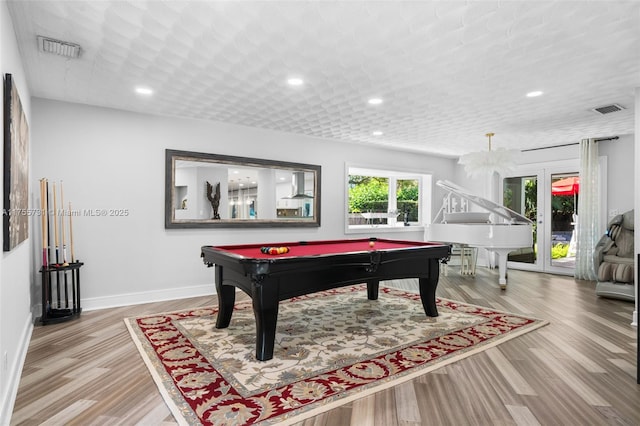 playroom with recessed lighting, visible vents, baseboards, and wood finished floors