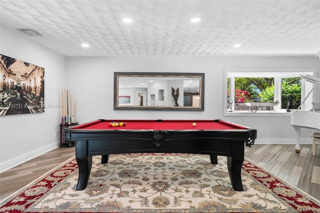 recreation room with wood finished floors, billiards, baseboards, and visible vents