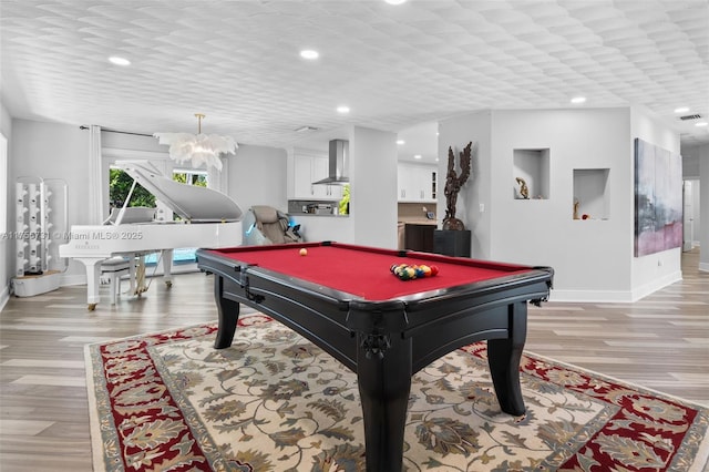 recreation room with recessed lighting, visible vents, light wood-style flooring, and baseboards