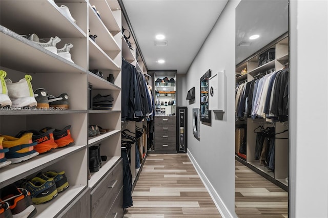 spacious closet with visible vents and light wood-type flooring