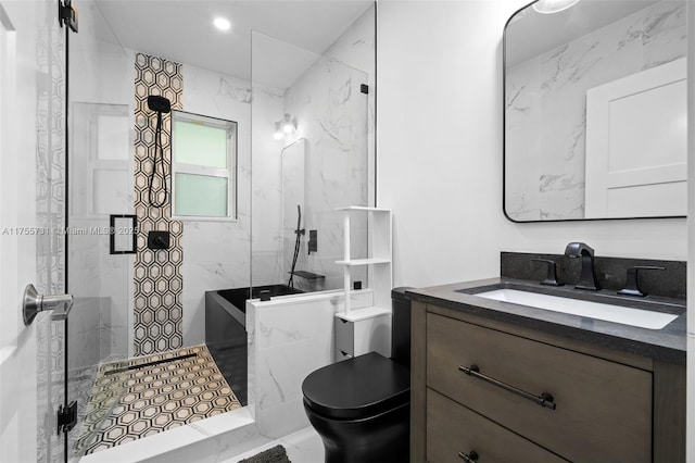 bathroom with toilet, a stall shower, and vanity