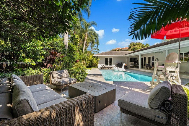 outdoor pool featuring a patio and an outdoor hangout area