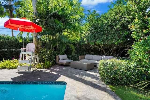 pool featuring a patio and an outdoor hangout area