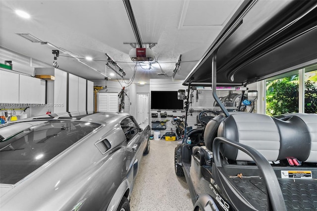 garage featuring a garage door opener