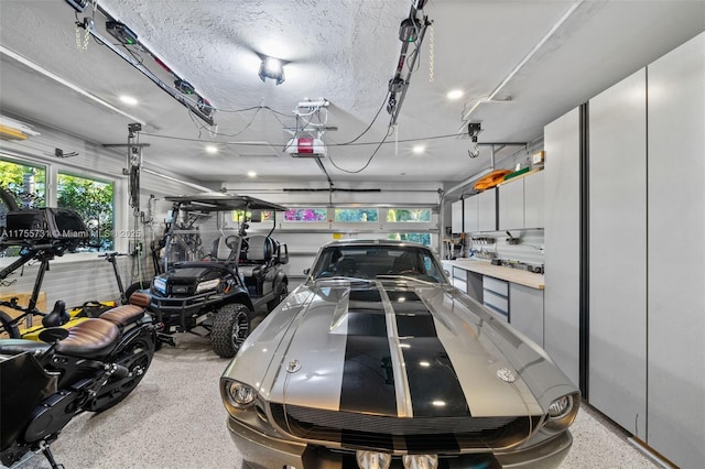 garage featuring a garage door opener