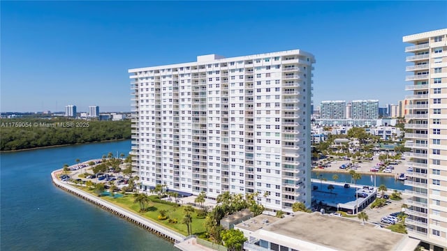 view of property with a view of city and a water view