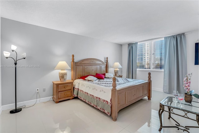 bedroom featuring baseboards