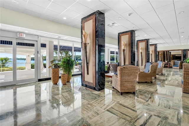 500 Bayview Dr Unit 231, Sunny Isles Beach, FL 33160 - building lobby featuring a water view, a paneled ceiling, and recessed lighting
