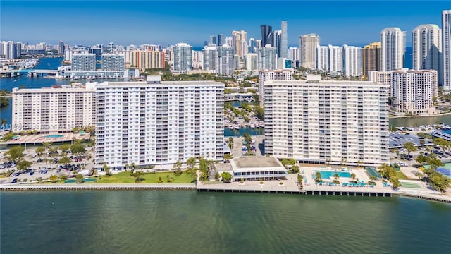 drone / aerial view with a view of city and a water view