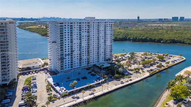 drone / aerial view with a water view and a view of city