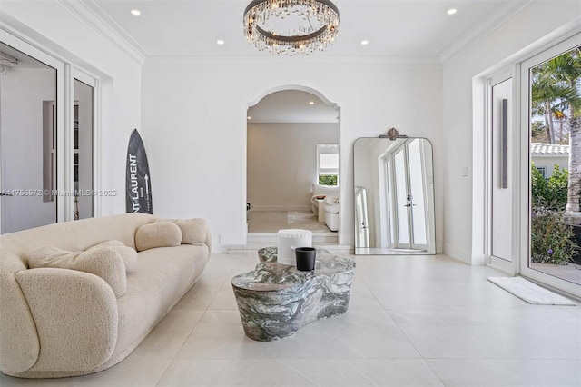 living area with tile patterned flooring, crown molding, recessed lighting, and arched walkways